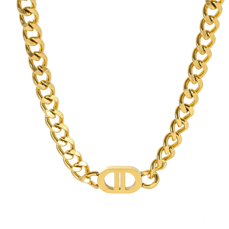 Elegant close-up of Auralin Emblem Chain displayed on a velvet stand