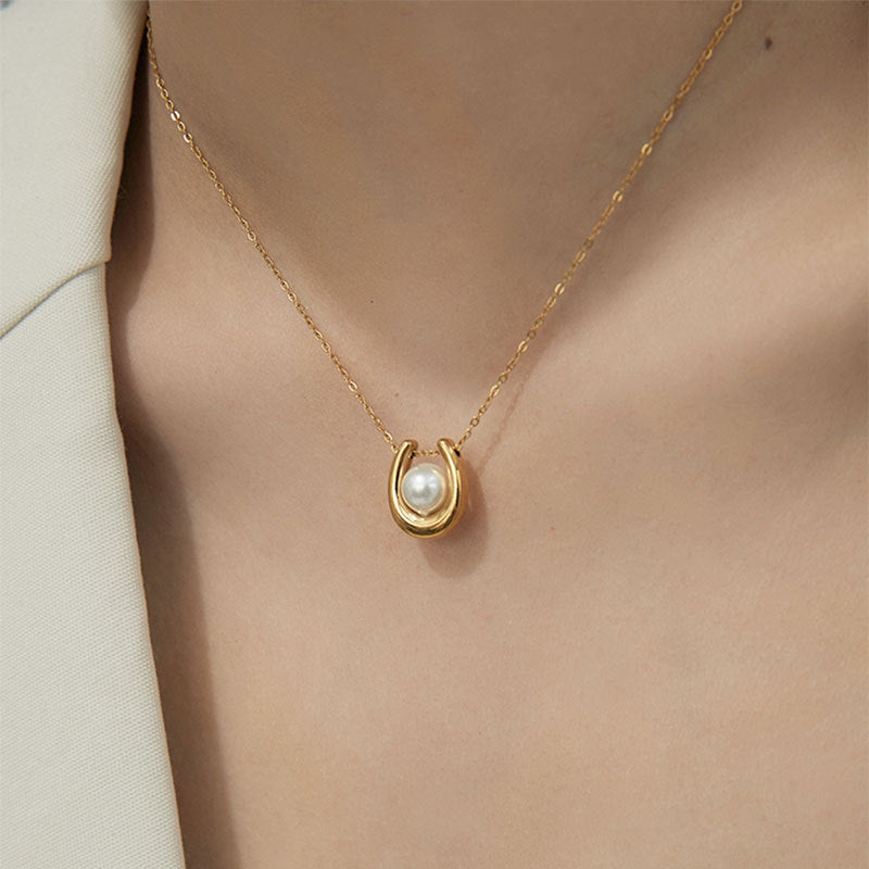 Elegant close-up of Pearl Haven Necklace displayed on a velvet stand
