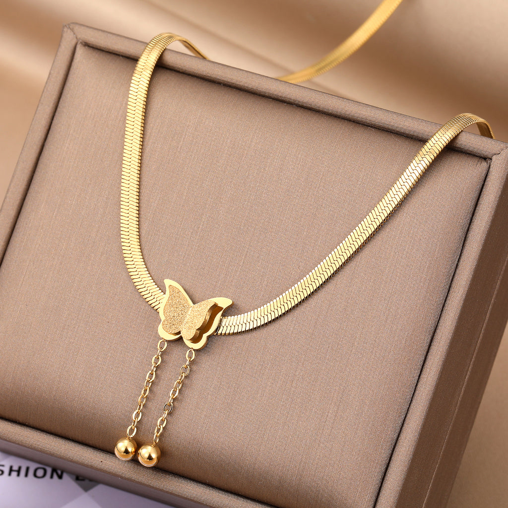 Elegant close-up of Butterglow Necklace displayed on a velvet stand
