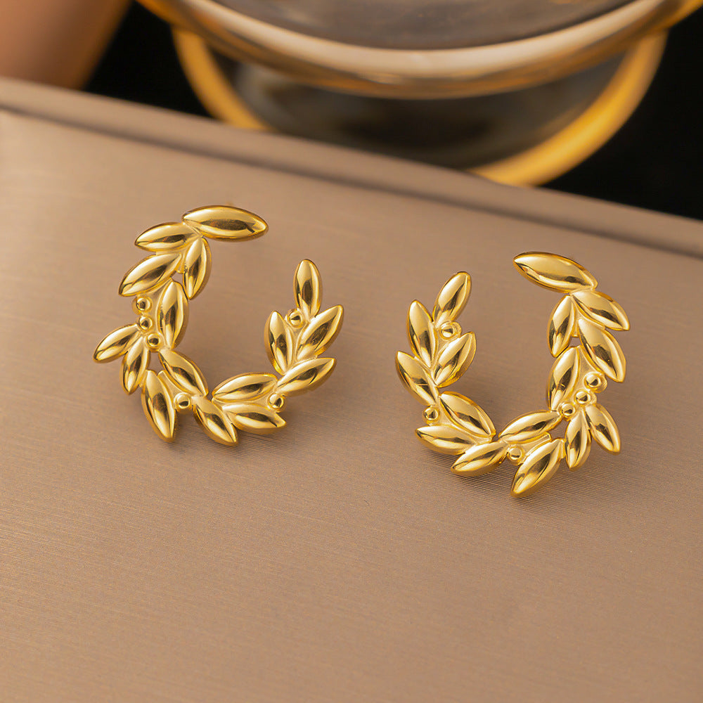 crown leaf earrings in gold finish; stylish crown leaf earrings for women