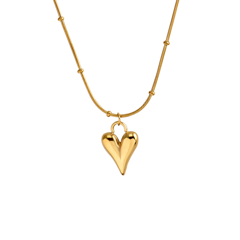 Elegant close-up of Loverâ€™s Curve Necklace displayed on a velvet stand