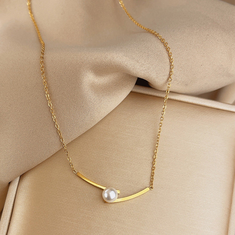 Elegant close-up of Opal Curve Necklace displayed on a velvet stand