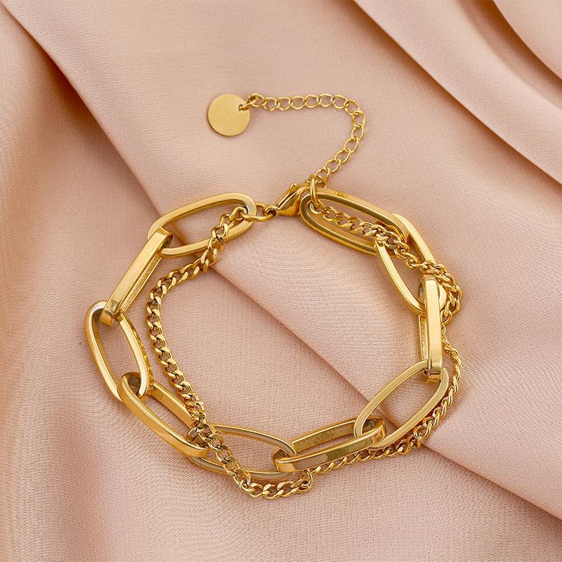 Close-up image of Auralin Emblem Bracelet on a white background