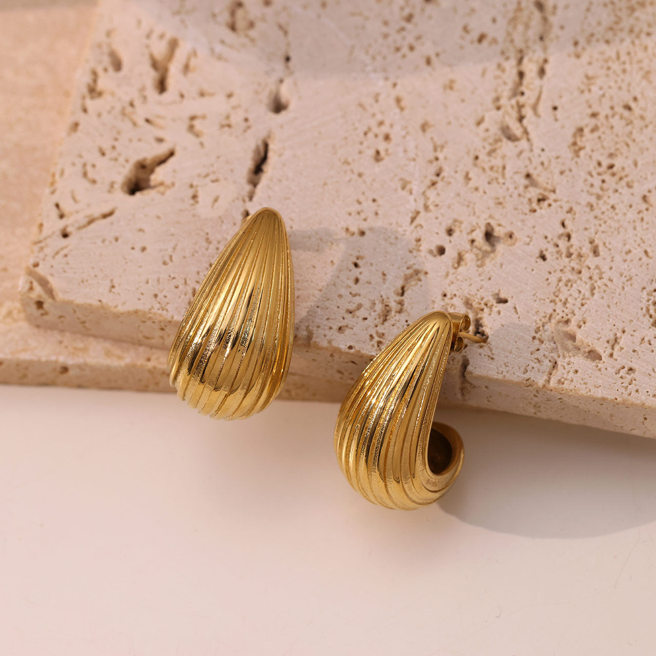 golden crest earrings in gold finish; stylish golden crest earrings for women