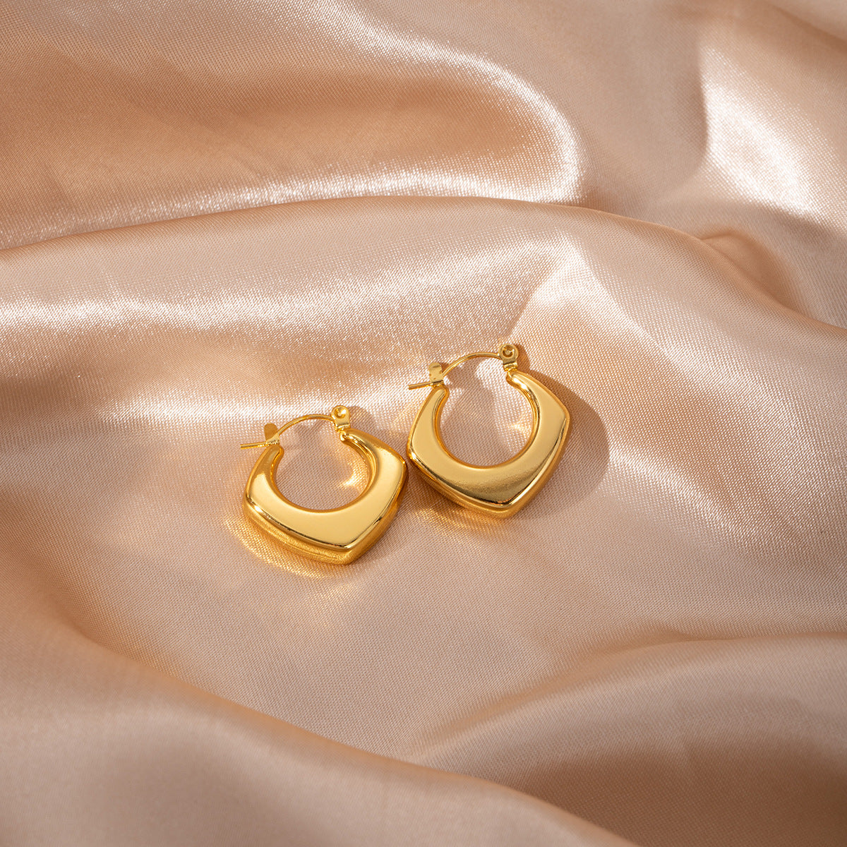 golden edge earrings in gold finish; stylish golden edge earrings for women
