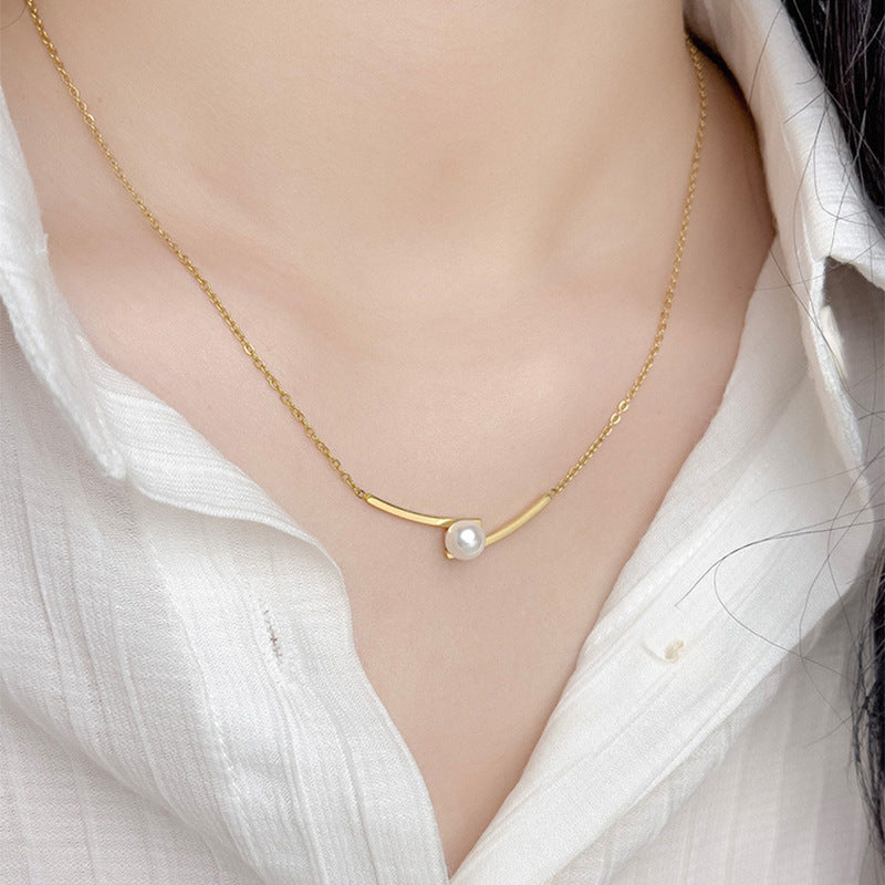 Elegant close-up of Opal Curve Necklace displayed on a velvet stand