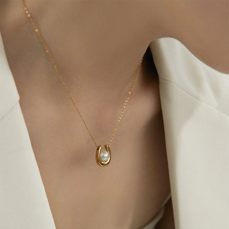 Elegant close-up of Pearl Haven Necklace displayed on a velvet stand