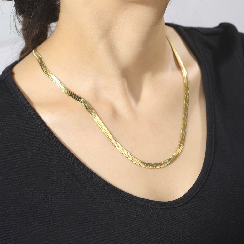 Elegant close-up of Golden Sleek Velvet Necklace displayed on a velvet stand