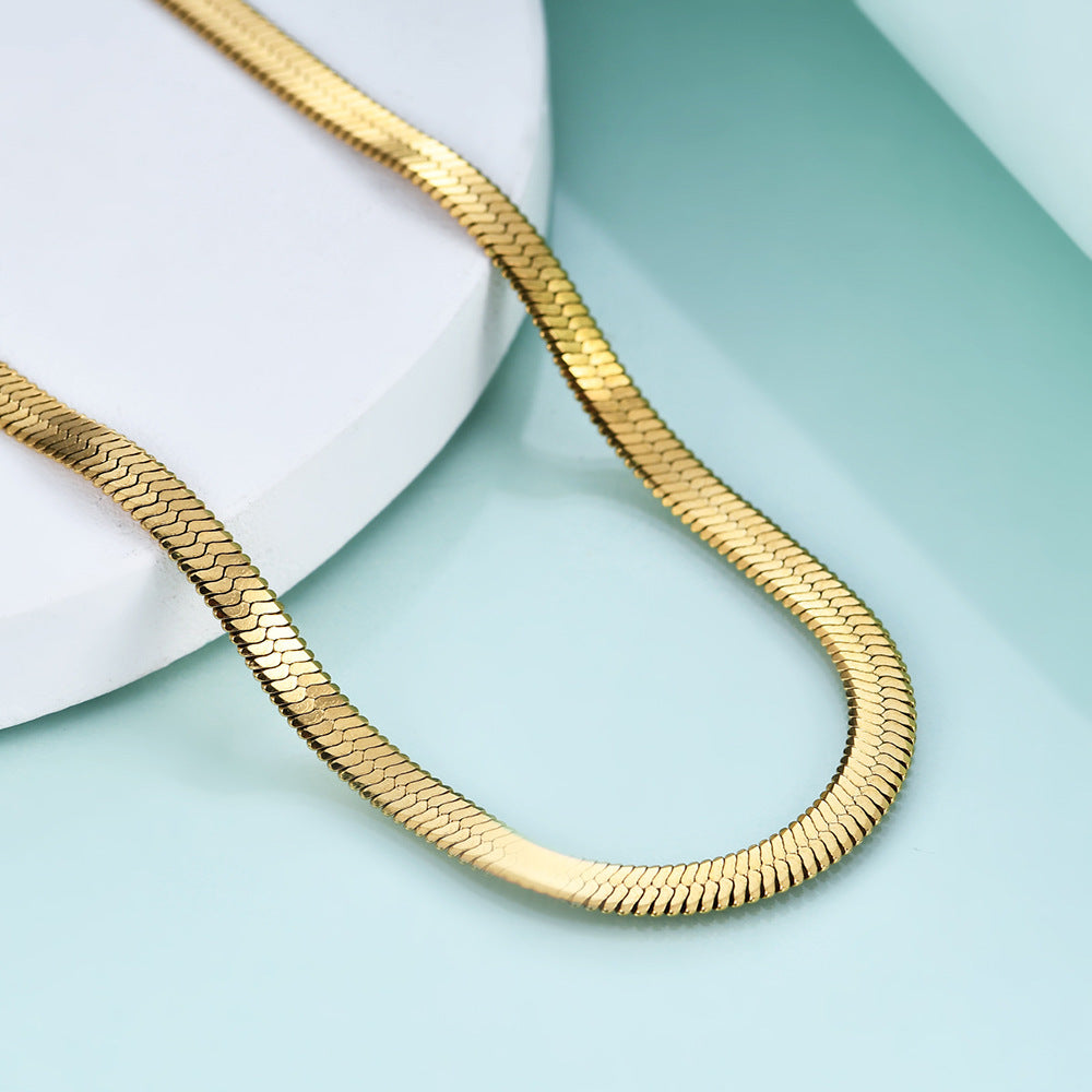 Elegant close-up of Gold Lume Chain displayed on a velvet stand