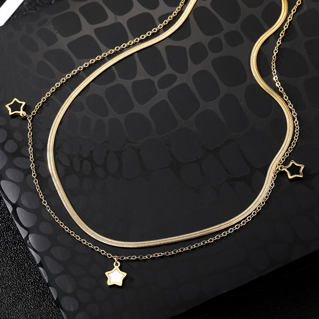 Elegant close-up of Stella Charm Necklace displayed on a velvet stand