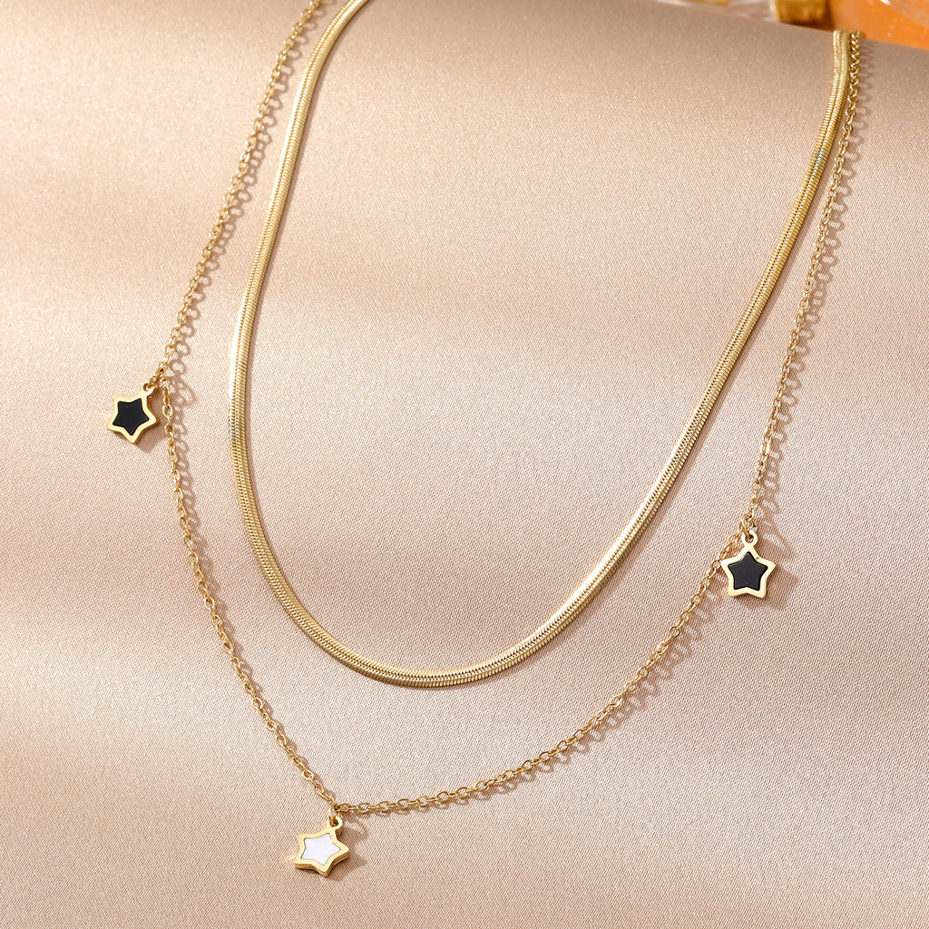 Elegant close-up of Stella Charm Necklace displayed on a velvet stand
