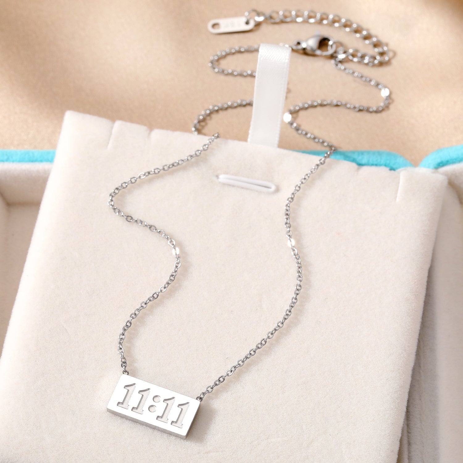 Elegant close-up of Moment Eleven Eleven displayed on a velvet stand
