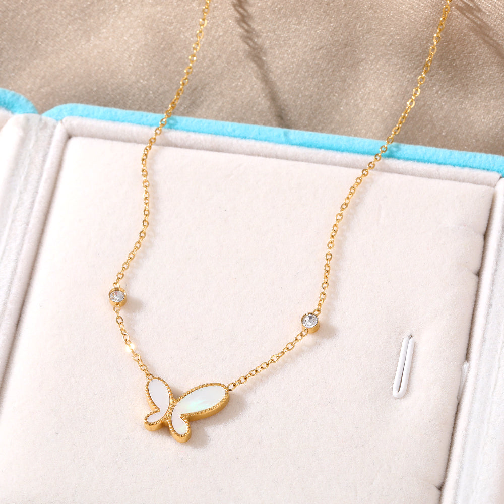 Elegant close-up of Butterfly Gleam Necklace displayed on a velvet stand