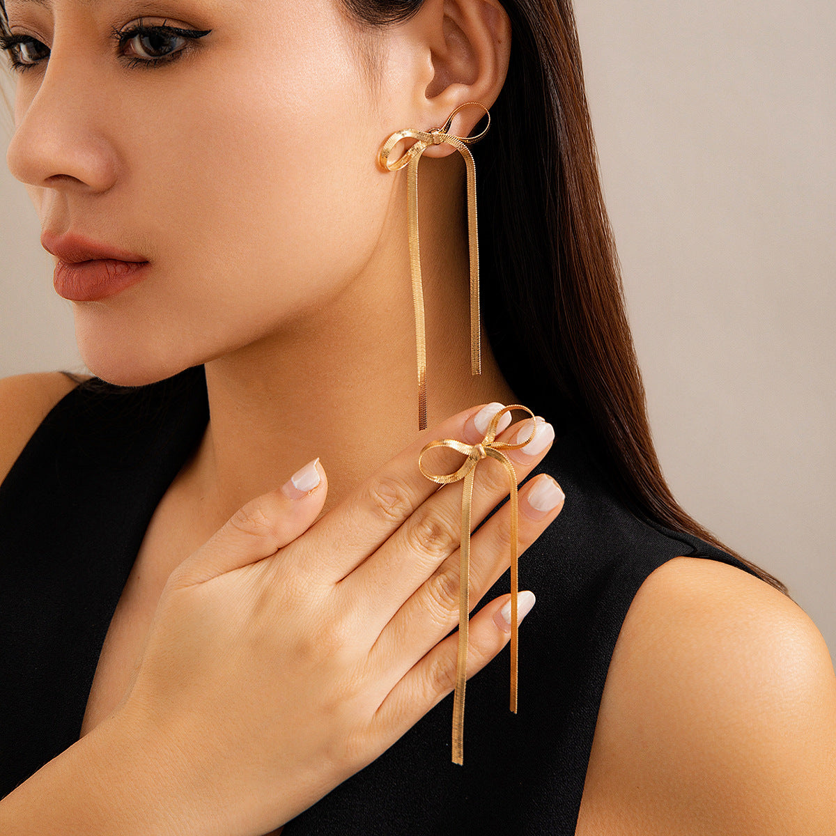 golden bow earrings in gold finish; stylish golden bow earrings for women
