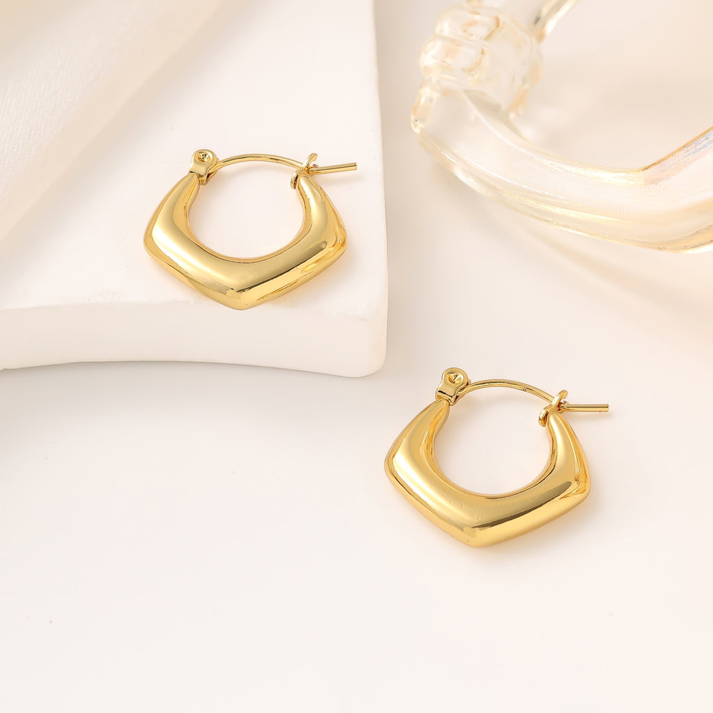 golden edge earrings in gold finish; stylish golden edge earrings for women