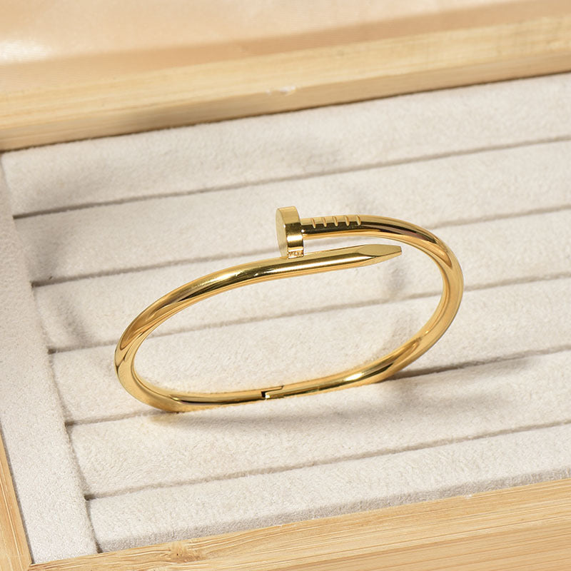 Close-up image of Golden Grip Bracelet on a white background