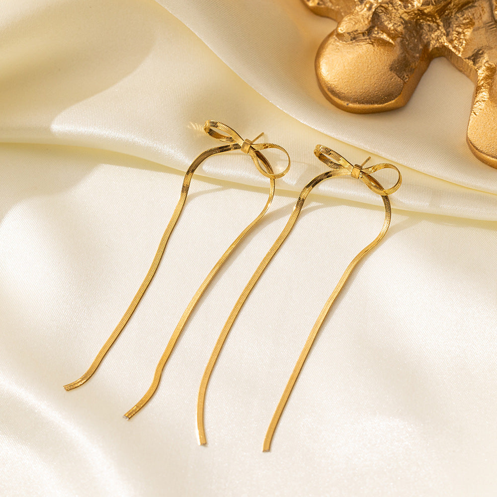 golden bow earrings in gold finish; stylish golden bow earrings for women
