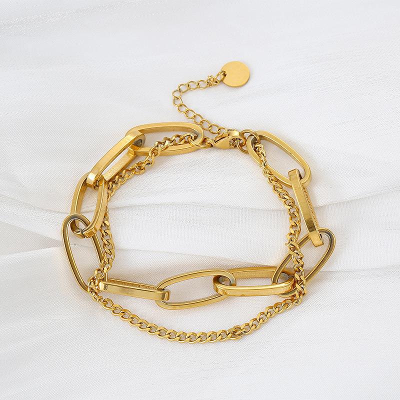 Close-up image of Auralin Emblem Bracelet on a white background