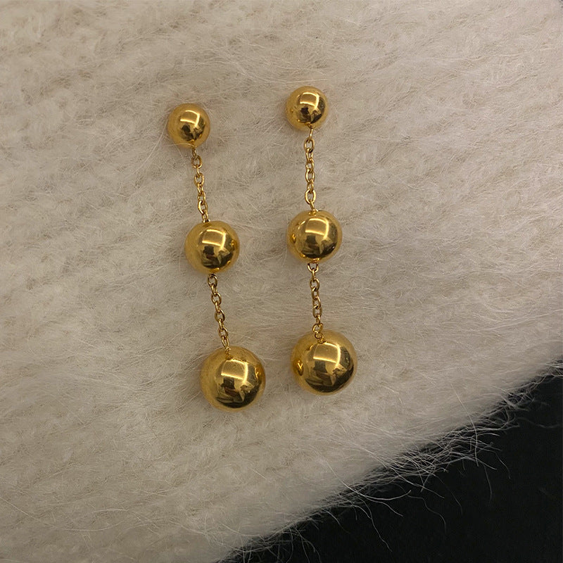 golden orbit earrings in gold finish; stylish golden orbit earrings for women
