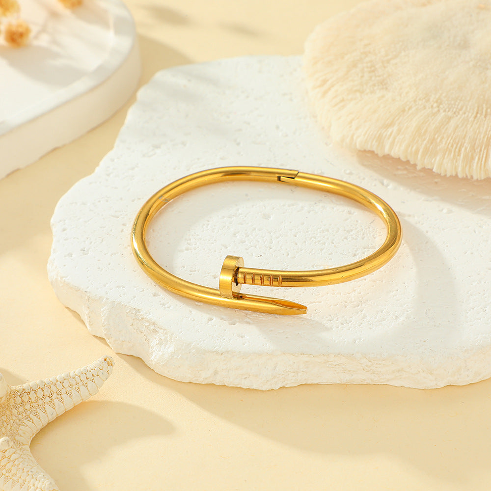 Close-up image of Golden Grip Bracelet on a white background