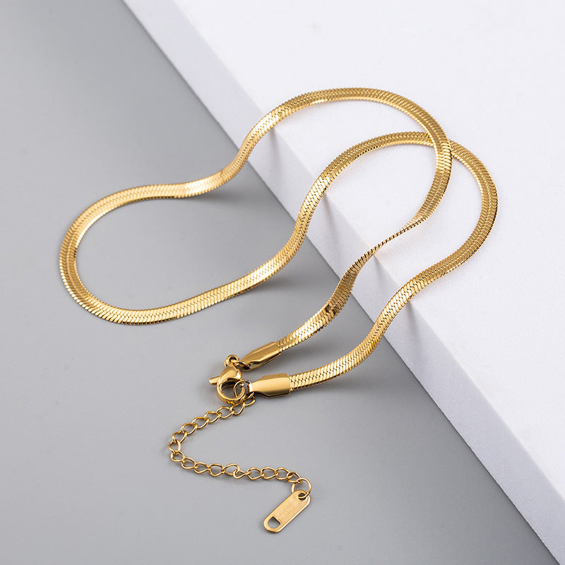 Elegant close-up of Gold Lume Chain displayed on a velvet stand