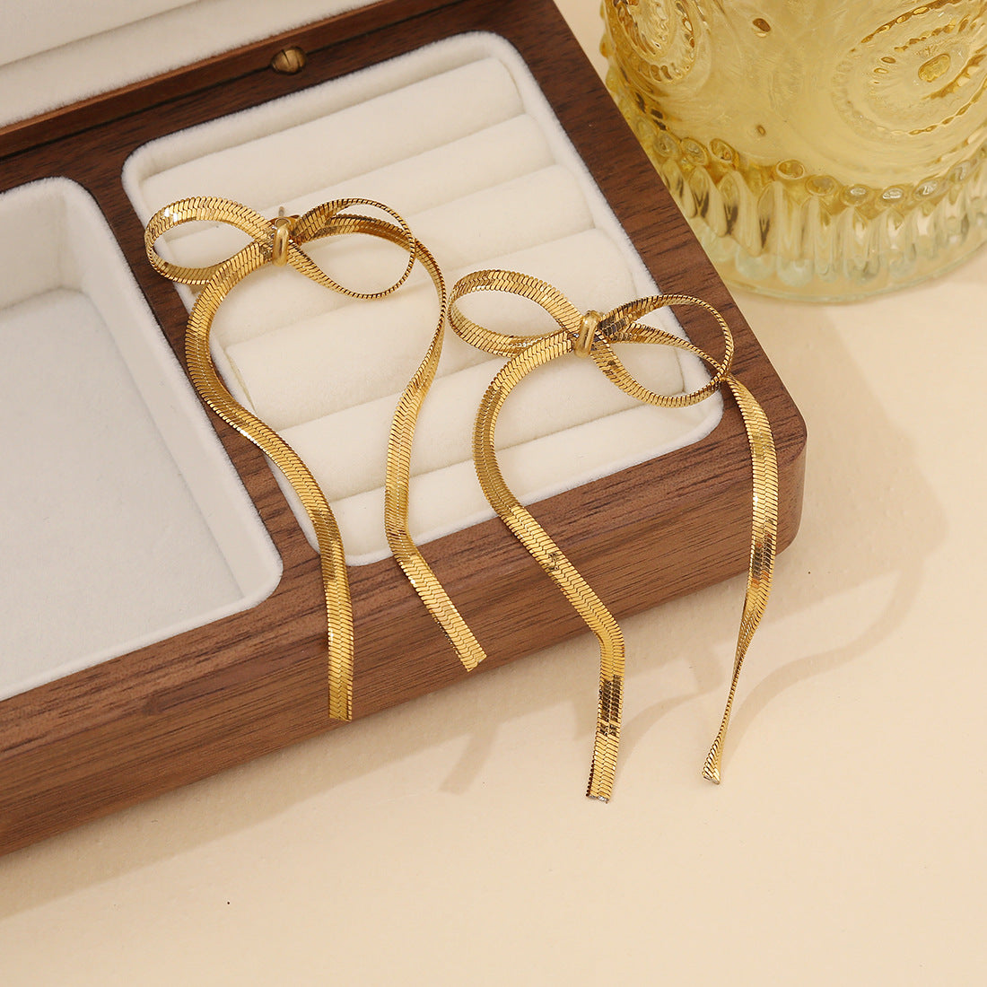 golden bow earrings in gold finish; stylish golden bow earrings for women