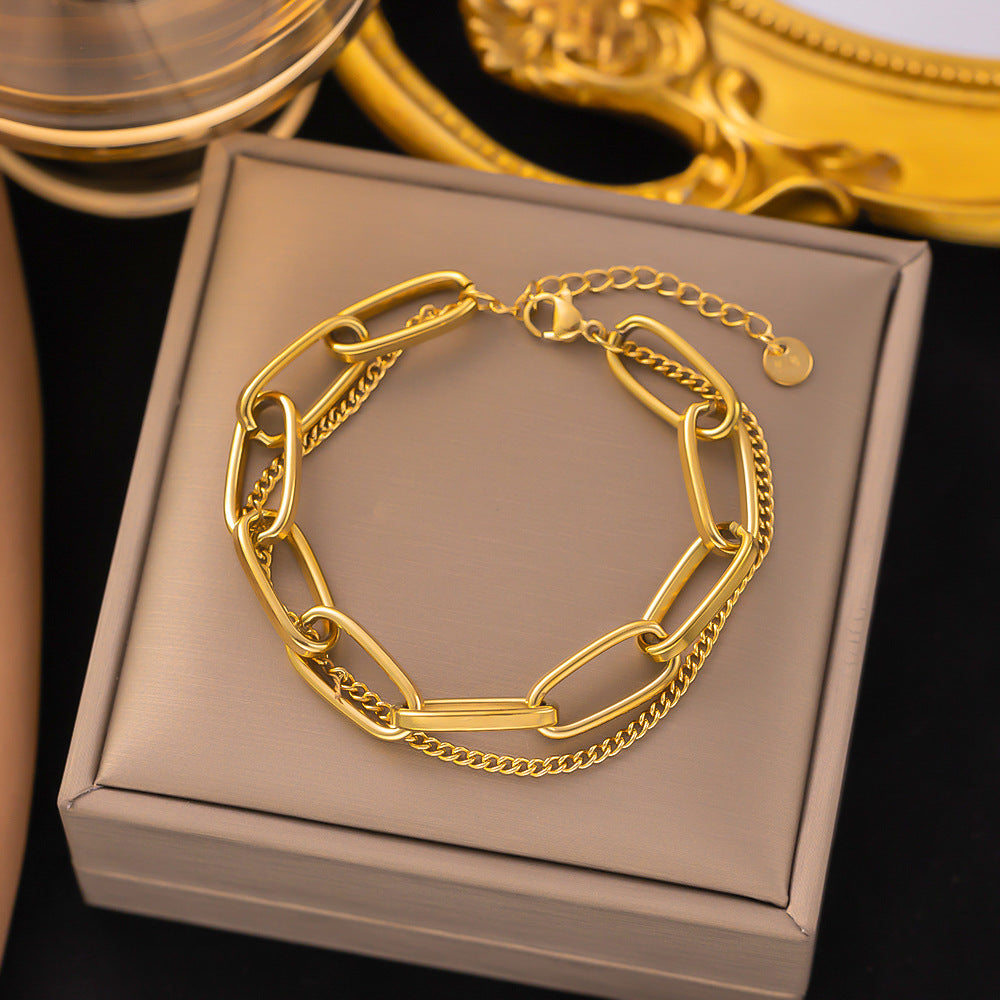 Close-up image of Auralin Emblem Bracelet on a white background