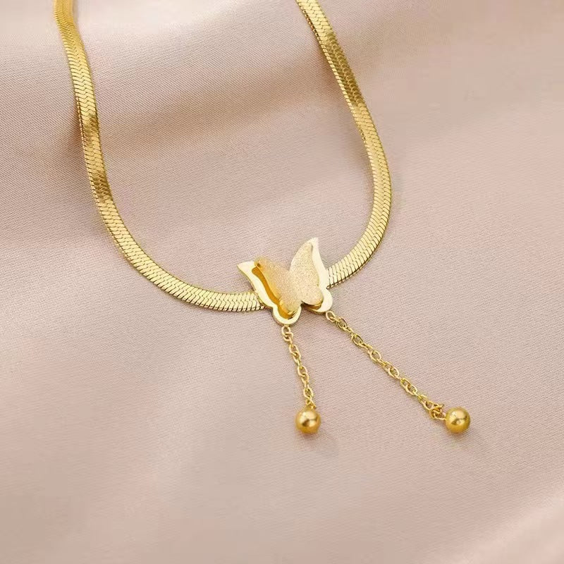 Elegant close-up of Butterglow Necklace displayed on a velvet stand