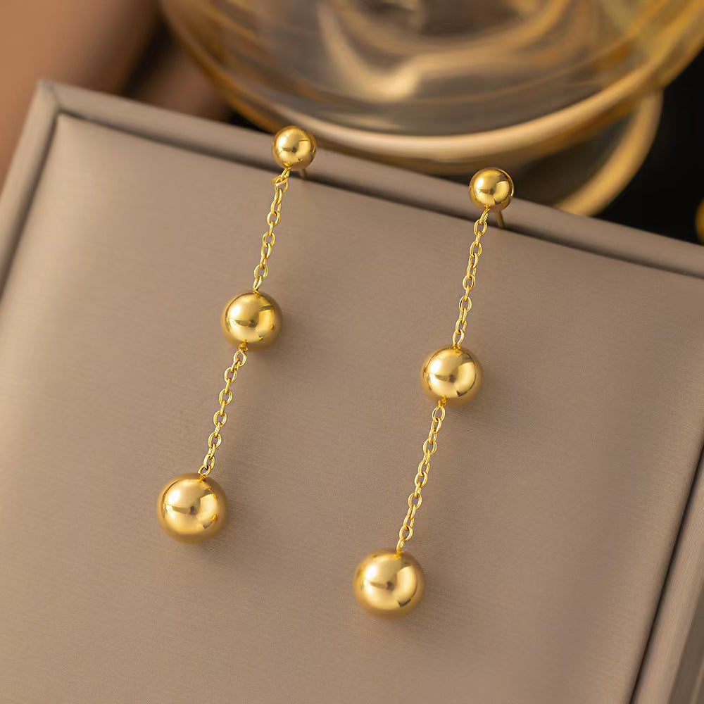 golden orbit earrings in gold finish; stylish golden orbit earrings for women
