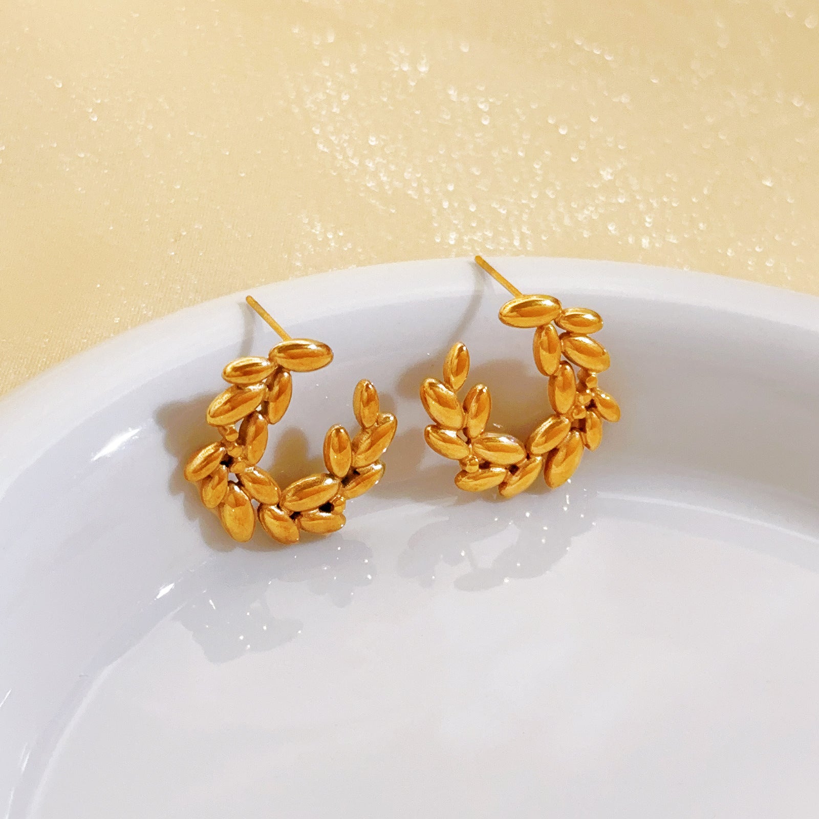 crown leaf earrings in gold finish; stylish crown leaf earrings for women