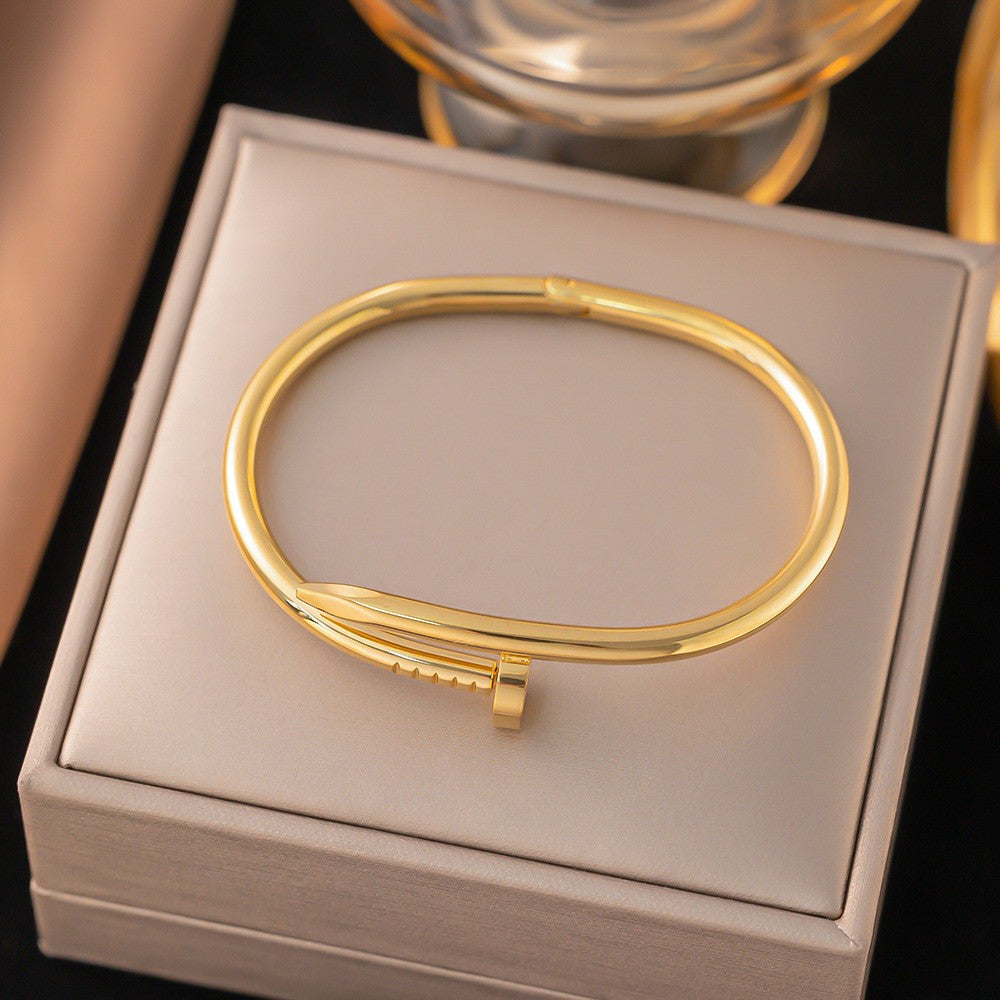 Close-up image of Golden Grip Bracelet on a white background