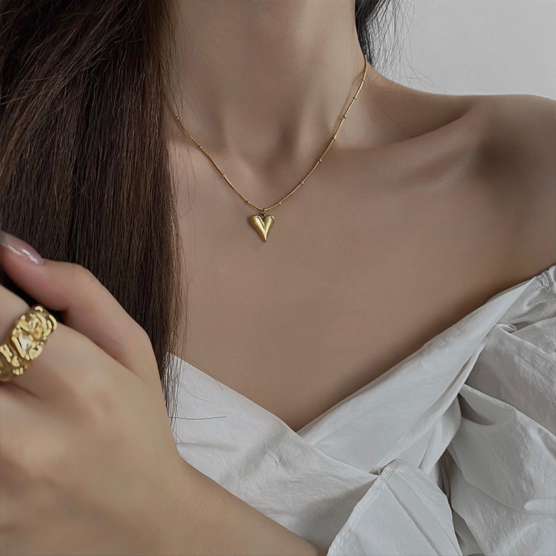 Elegant close-up of Loverâ€™s Gold displayed on a velvet stand