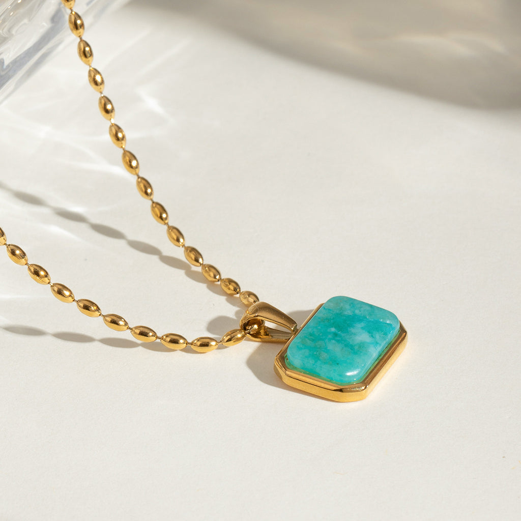 Elegant close-up of Oceanstone Necklace displayed on a velvet stand